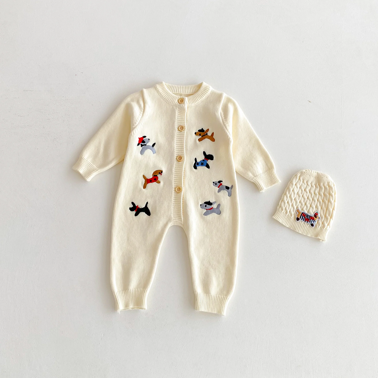 PlayfulKnit – Soft & Cute – Knitted Baby Jumpsuit with Dog Print